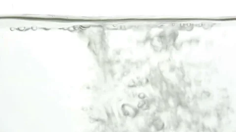 A rush of water in a glass close up Stock Footage 77342537