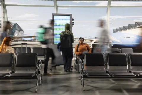 Rushing, digital flights timetable and passengers dynamic movement in airport Stock Photos