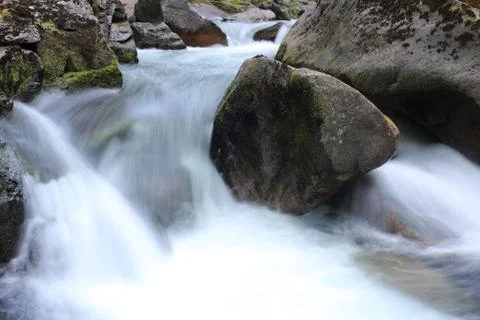 Rushing flowing water Stock Photos