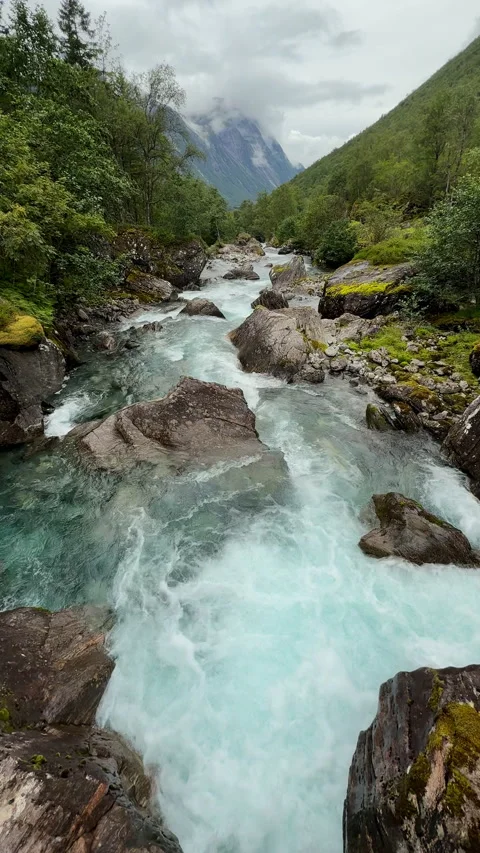 Rushing glacial river flowing through norwegian valley Stock-Footage 324598191