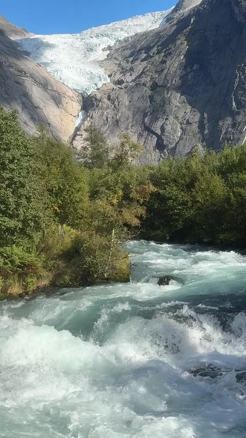 Rushing Glacial River In Oldedalen With Briksdalbreen Glacier View Norway Stock-Footage 346970032