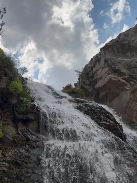 Rushing Mountain Waterfall Flowing Over Rocky Cliff Video stock 342265660