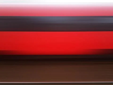 Rushing red train motion blur background Stock Photos