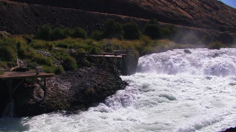 RUSHING RIVER AND NATIVE AMERICAN FISHING PLATFORMS Stock Footage 53281697