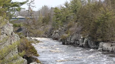 RUSHING RIVER WITH BRIDGE Stock Footage 50777563