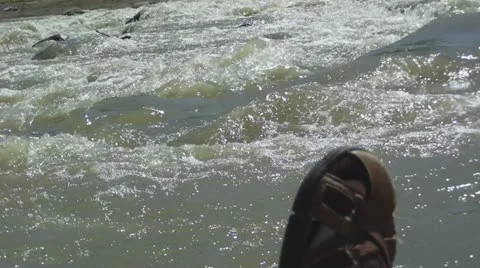 Rushing River & Leather Sandal Stock Footage