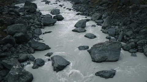 Rushing river under epic snowy mountain Stock Footage 140610778