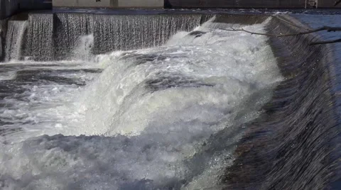 A rushing river of water from a set of falls. 4K or 1080p Stock Footage 61324347