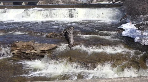 A rushing river of water from a set of falls. 4K or 1080p Stock Footage 61335660