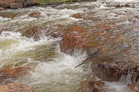 Rushing Stream in the Mountains Фото