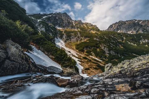 Rushing stream in mountains Stock Photos