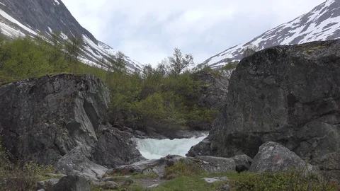 Rushing stream mountains snow Stock Footage 77246114
