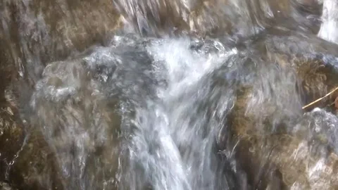 Rushing Stream Over Rocks Stockbeeldmateriaal 334798316