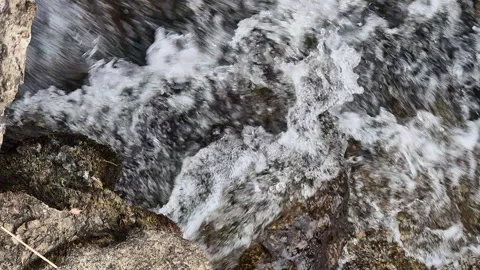 Rushing stream water over rocks Stock Footage 318524398
