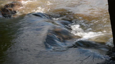 Rushing water over rocks Stock Footage 67526177
