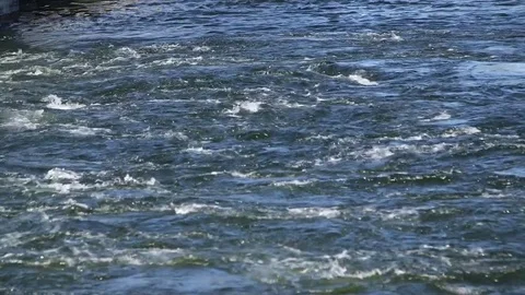 Rushing water with small white caps Stock Footage 83990790