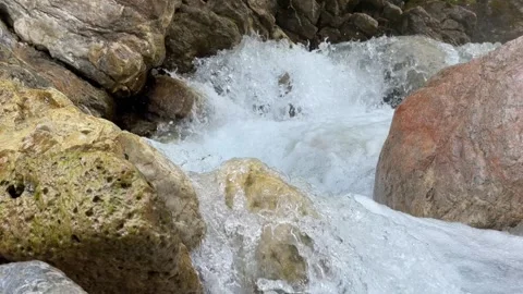 Rushing Water Through Rocks in the Alps Stock Footage 279566220