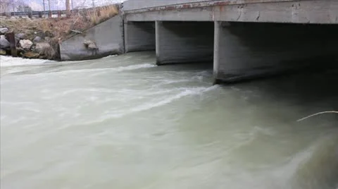 Rushing water under bridge Video stock 10831079