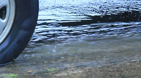 Rushing water under car Stock Footage 22732356