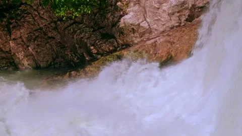 The rushing water of a waterfall Stock Footage 234991979