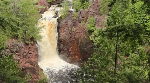 Rushing waterfall in a lush forest. Stock Footage 50984759