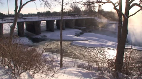 Rushing waterfalls and  river with snow and ice. #4 Stock Footage 34642902