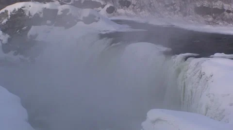 Rushing waterfalls and  river with snow and ice. #15 Stock Footage 34643228
