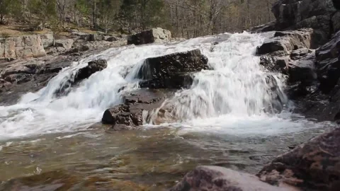 Rushing White Water Cascading Over Ancient Granite Boulders Video stock 333430706