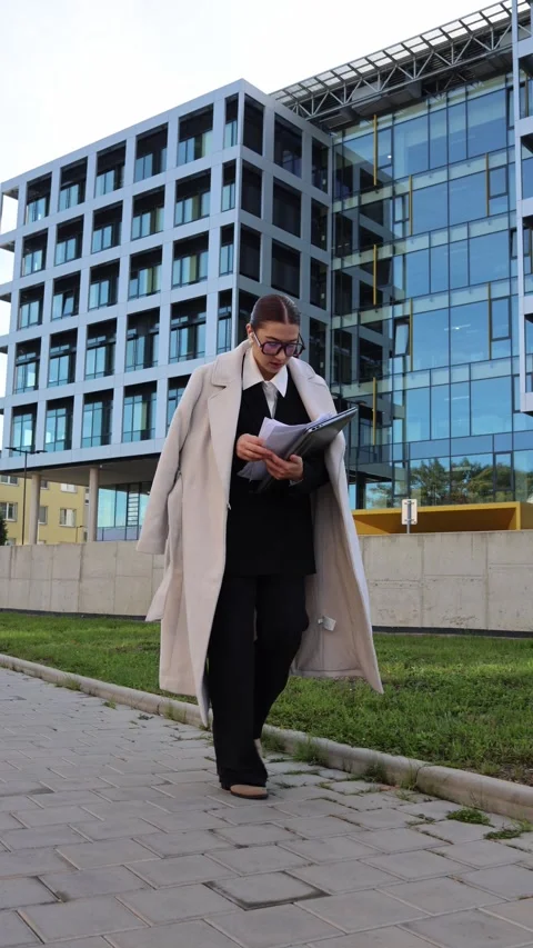 Rushing woman dropping documents Stock Footage 325453780