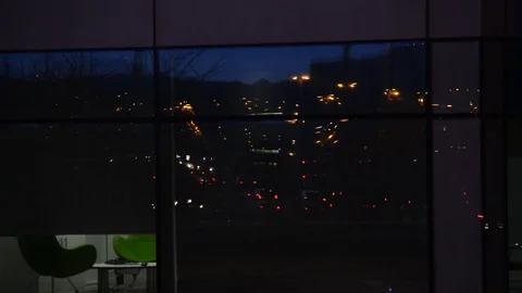Rushour traffic reflected in office window leeds united kingdom Stock Footage 73296471