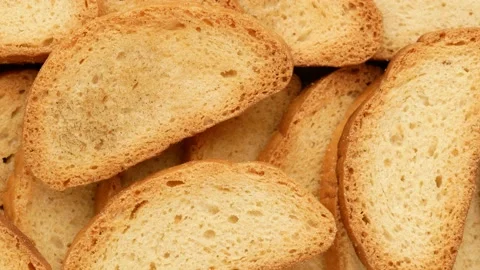 Rusks - background. Dried bread with a golden crust, dolly shot. Stock Footage 140724730
