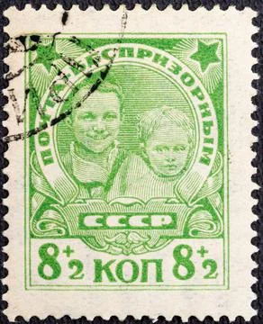 RUSSIA - CIRCA 1927: stamp printed in the USSR Soviet Union . Street children Stock Photos