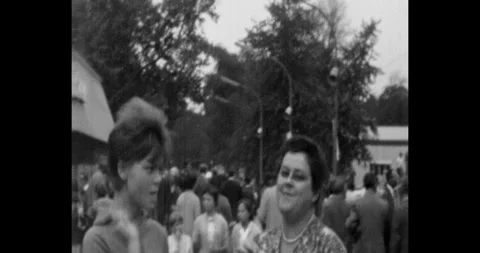 Russia - circa 1970s: Group of Soviet people walking and smiling in a city park, Vídeo Stock 340329300