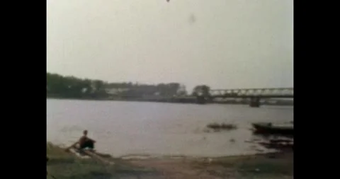 Russia - circa 1970s: River landscape with a metal bridge and silhouettes Stock-Footage 330896830