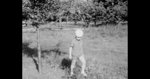 Russia - circa 1970s: Small boy exploring nature. USSR historical footage 스톡 동영상 328362060