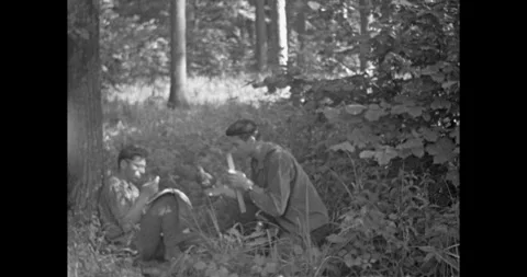 Russia - circa 1970s: Two men in the forest fighting off annoying gnats 库存影片 333205409