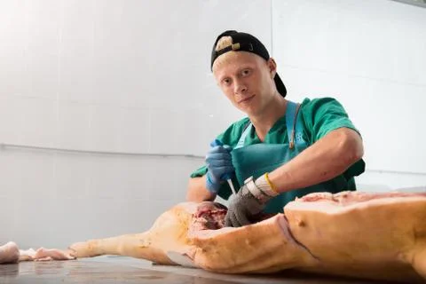 Russia - July, 2016: : Man processing pork Stock Photos