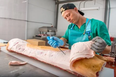 Russia - July, 2016: : Man processing pork Stock Photos