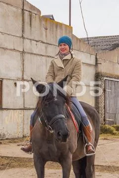 Russia, Leningrad region, Nikolskoye March 25, 2017-at the stable horse ridin Stock Photos