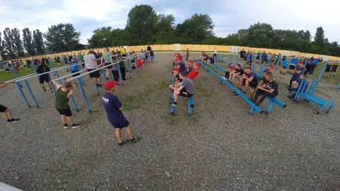RUSSIA, MAYKOP - AUGUST 2, 2019. Athletic cadets on morning exercises. Warm up b Stock Footage 125666100