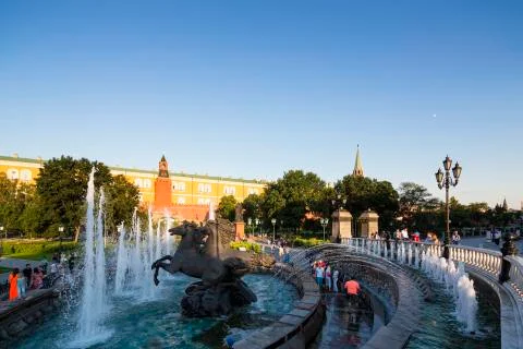 Russia, Moscow, Alexander Garden, fountain four seasons and Kremlin wall Stock Photos