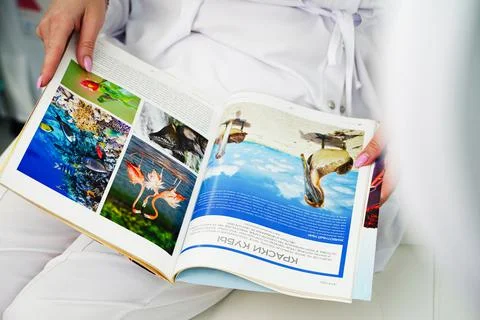 Russia, Moscow - July 2, 2021 Magazine in Russian about travel, the page was Stock Photos