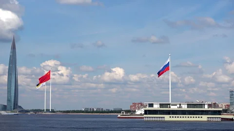 Russian and Chinese flags waving proudly in the wind against a blue sky wit.. Stock Footage 323973295