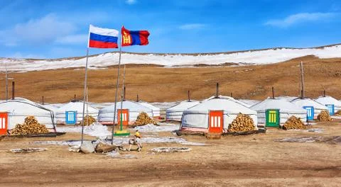 Russian and Mongolian flag next to gers (yurts) Stock Photos