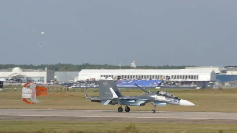 Russian Armed Forces military fighter plane lands with open brake parachute Stock Footage 171006053