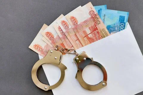 Russian banknotes in an envelope on a gray background. The concept of a bribe Stock Photos