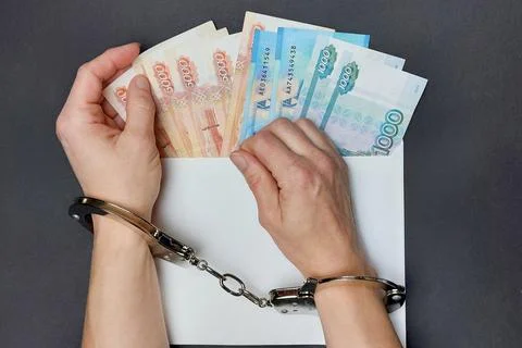 Russian banknotes in an envelope on the table. The concept of a bribe. Women's Stock Photos