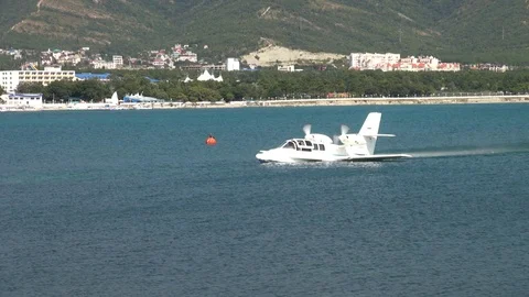 Russian Beriev Be-103 light amphibious aircraft floats in sea like boat. Stock Footage 125610780