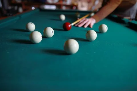 Russian billiard balls, cue, triangle, chalk on a table Green cloth Copy spac Stock Photos