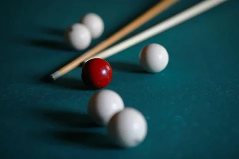 Russian billiard balls, cue, triangle, chalk on a table Green cloth Copy spac Stock Photos